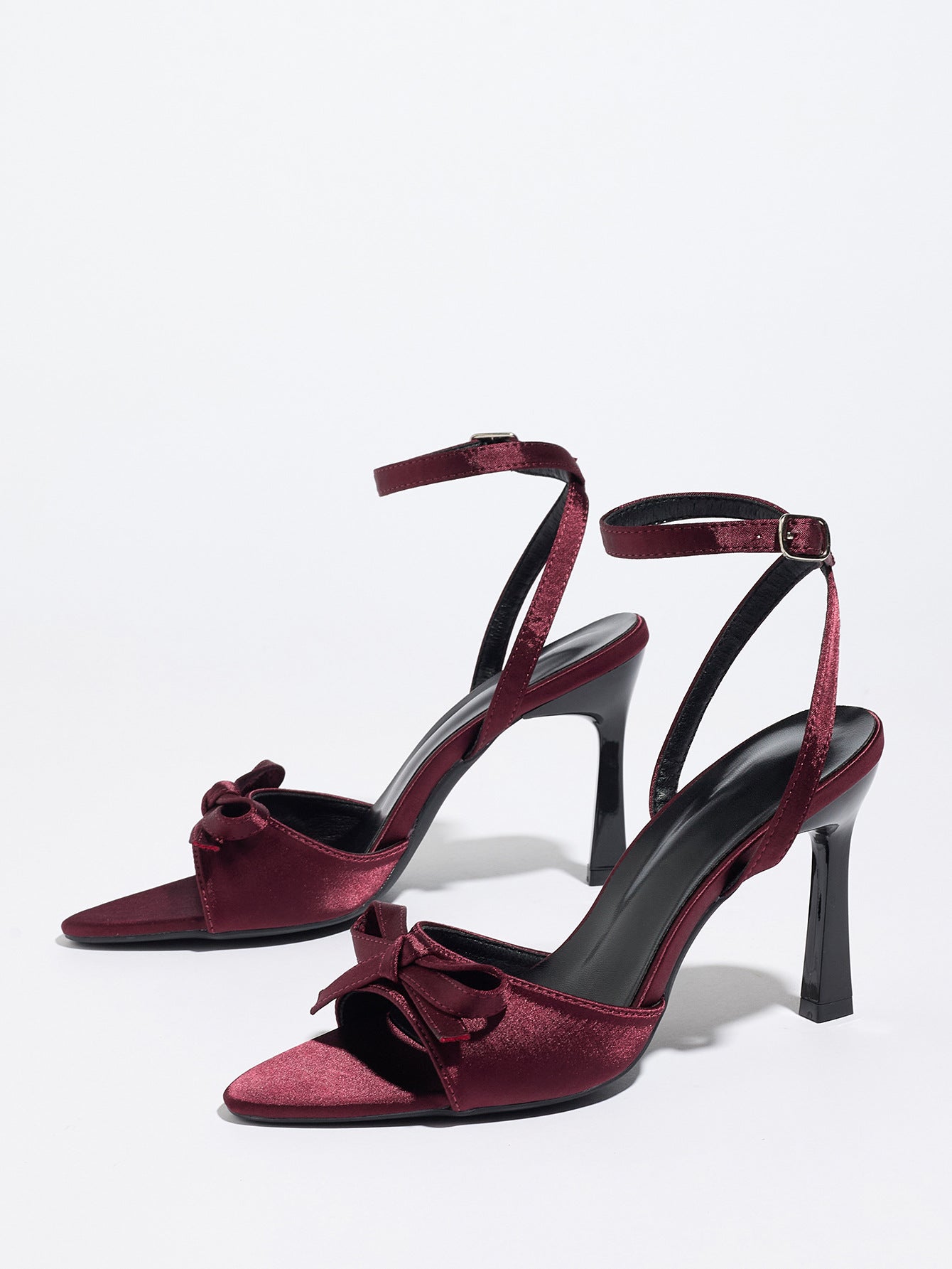Mescini burgundy satin bow ankle strap sandals, angled pair on a white studio floor, US women's sizes