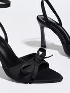 Mescini black satin bow ankle strap sandals, close up of the knotted trim and toe, US women's sizes