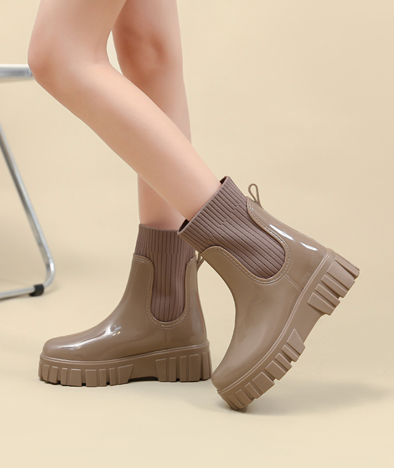 Mescini khaki glossy platform chelsea rain boots, worn standing on tiptoe, US women's sizes