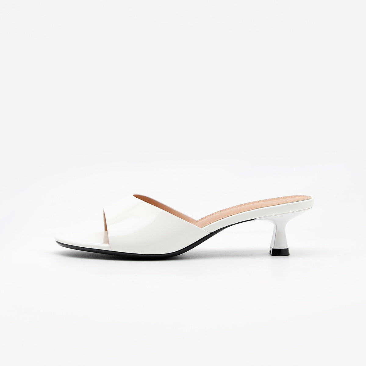 Mescini white square toe slide kitten heel sandals, single shoe seen from the side, US women's sizes