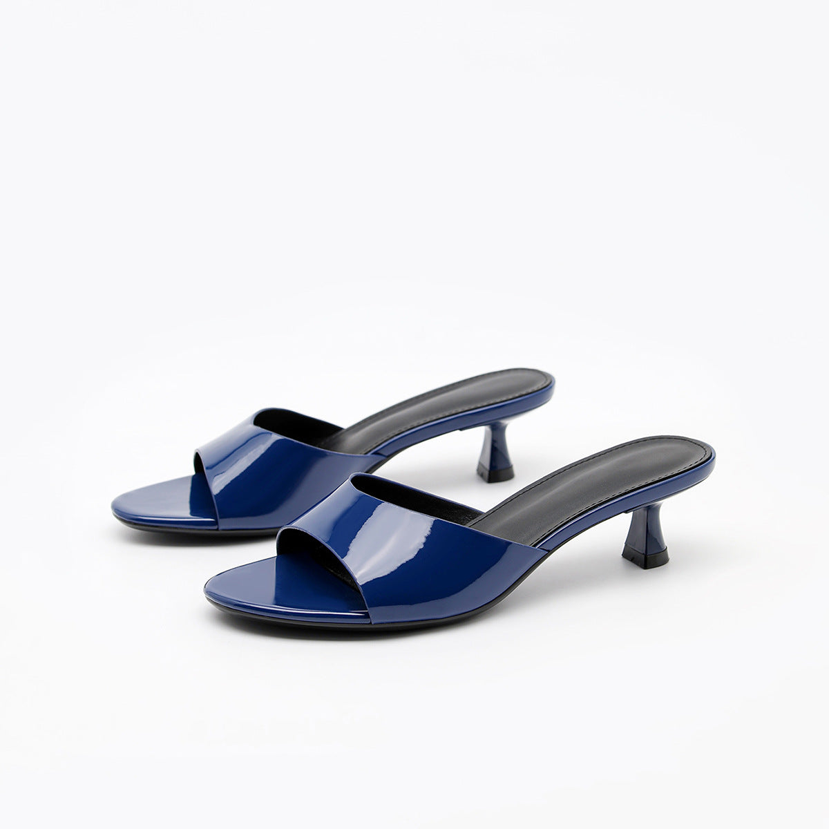 Mescini navy square toe slide kitten heel sandals, angled pair on white, US women's sizes