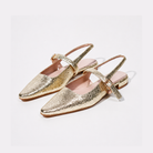 Mescini – Gold crackle mary jane slingbacks, angled studio pair with pink lining, US women's sizes