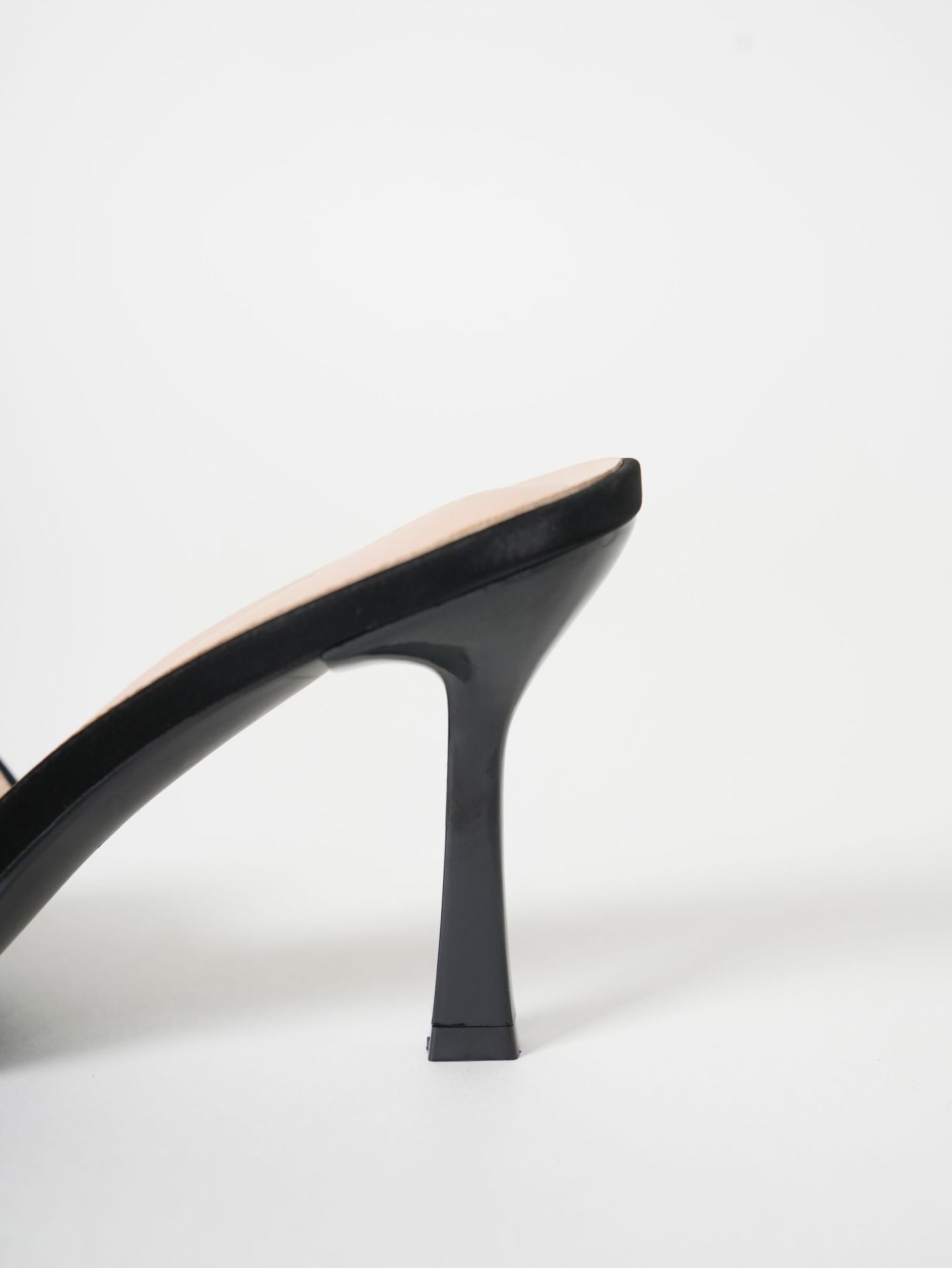 Mescini black wide band square toe mule, close view of the flared stiletto, US women's sizes