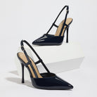 Mescini black patent pointed toe slingback heels, angled pair on a white block, US women's sizes