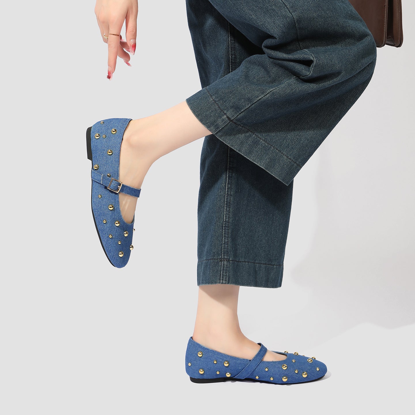 Mescini blue studded denim mary jane flats worn with wide leg jeans, US women's sizes