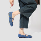 Mescini blue studded denim mary jane flats worn with wide leg jeans, US women's sizes
