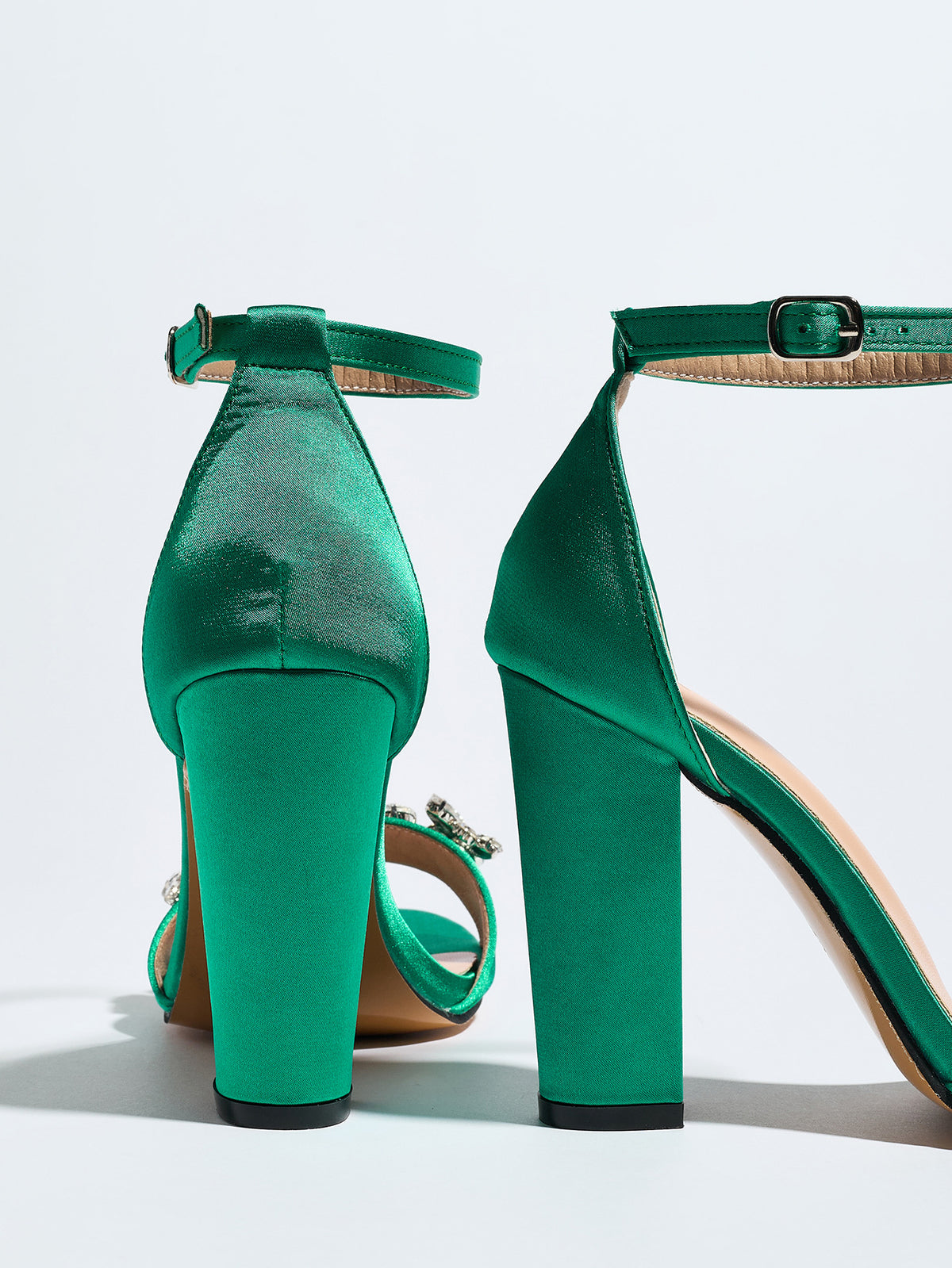 Mescini green crystal strap block heel sandals, rear view against a white wall, US women's sizes