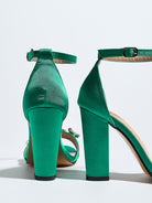 Mescini green crystal strap block heel sandals, rear view against a white wall, US women's sizes