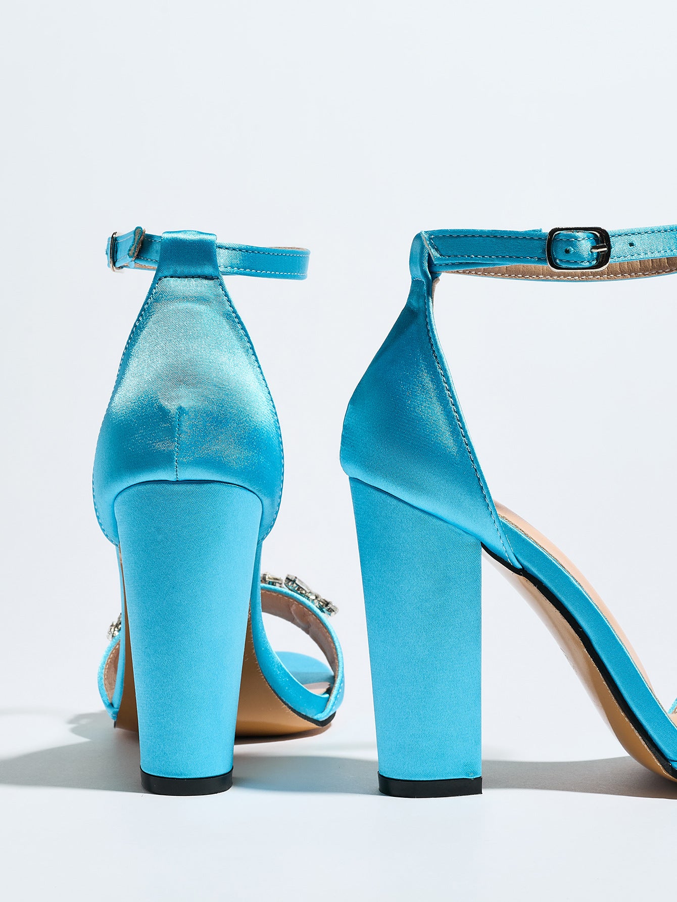 Mescini sky blue crystal strap block heel sandals, rear view on a plain background, US women's sizes