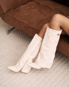Mescini cream fold over knee high boots, pointed toes seen from above, US size guide