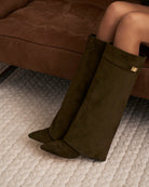 Mescini olive green fold over knee high boots, angled pair view on a pale floor, US sizes