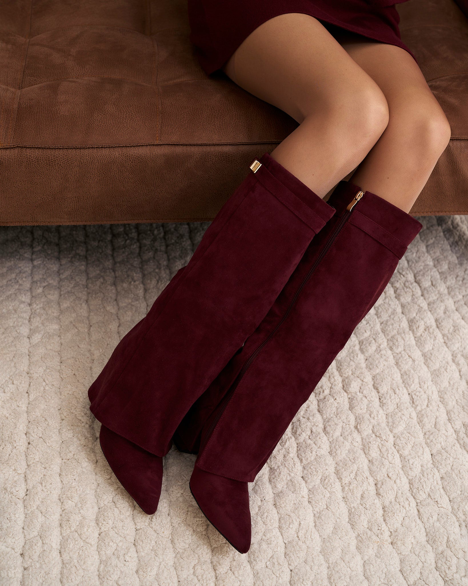 Mescini burgundy fold over knee high boots, angled pair view on a pale floor, US sizes