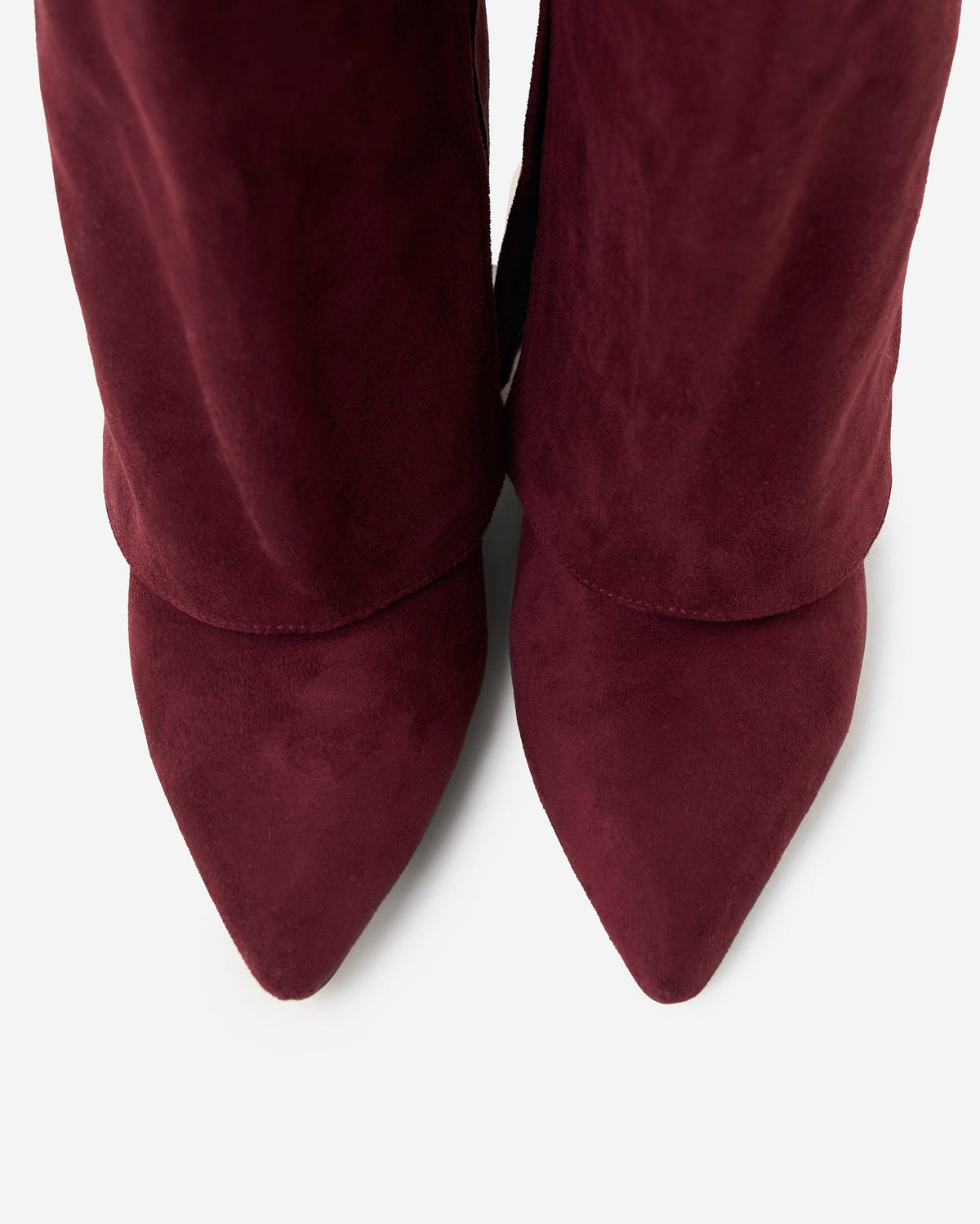 Mescini burgundy fold over knee high boots, worn by a model seated on a bench, US sizes