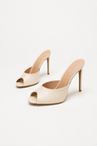 Mescini apricot sculpted peep toe stiletto mules, angled pair on a soft neutral backdrop, US women's sizes