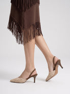 Mescini brown crochet pointed toe slingback heels, worn mid step, side profile view, US women's sizes