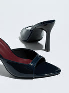 Mescini navy square open toe stiletto mules, close up with the second shoe on its side, US women's sizes