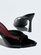 Mescini black square open toe stiletto mules, close up with one shoe lying on its side, US women's sizes