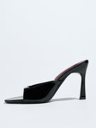 Mescini black square open toe stiletto mules, single shoe in side profile on grey, US women's sizes