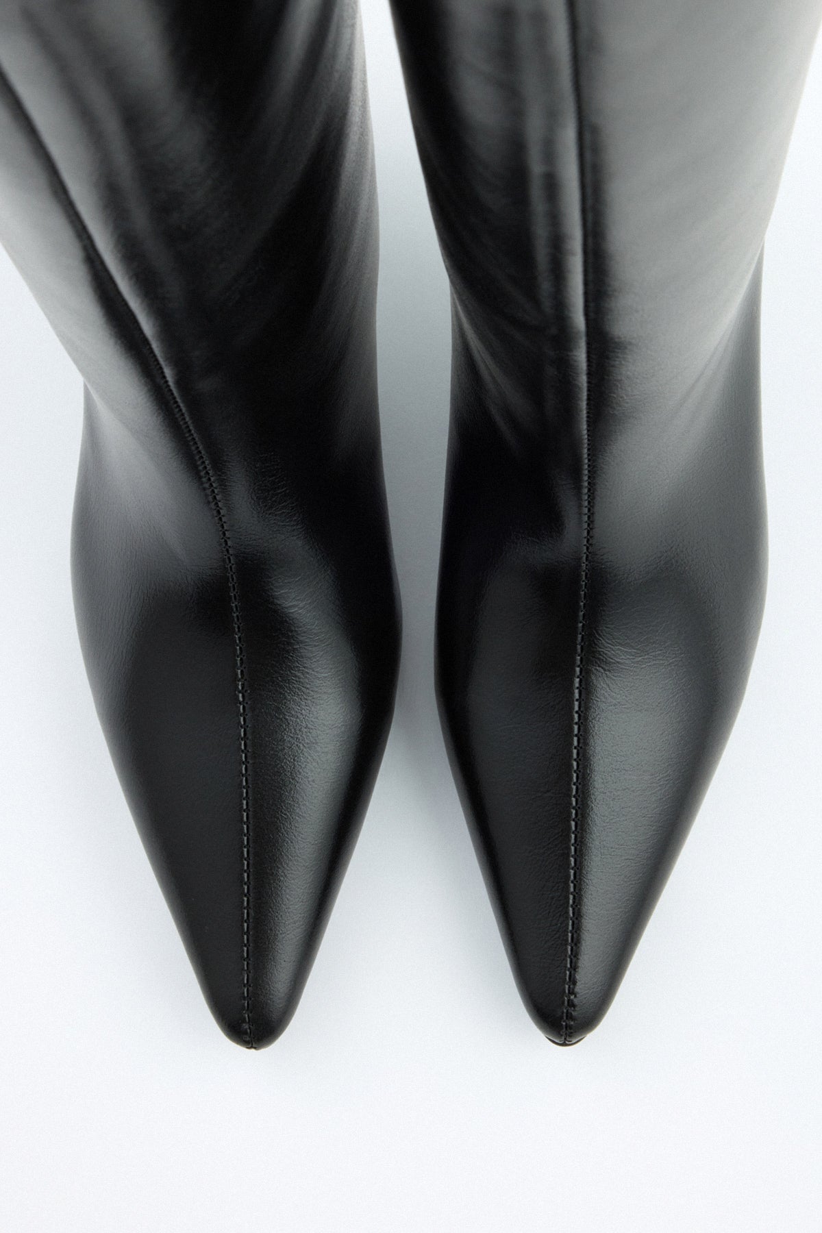 Mescini black pointed toe knee high boots, rear view of the slim spool heel, US sizes