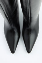 Mescini black pointed toe knee high boots, rear view of the slim spool heel, US sizes