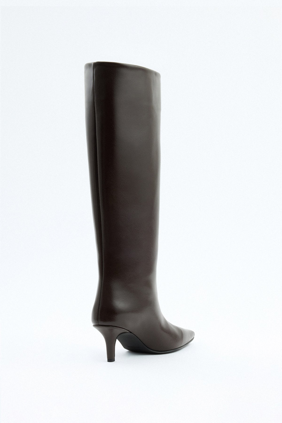 Mescini dark brown pointed toe knee high boots, rear view of the slim spool heel, US sizes