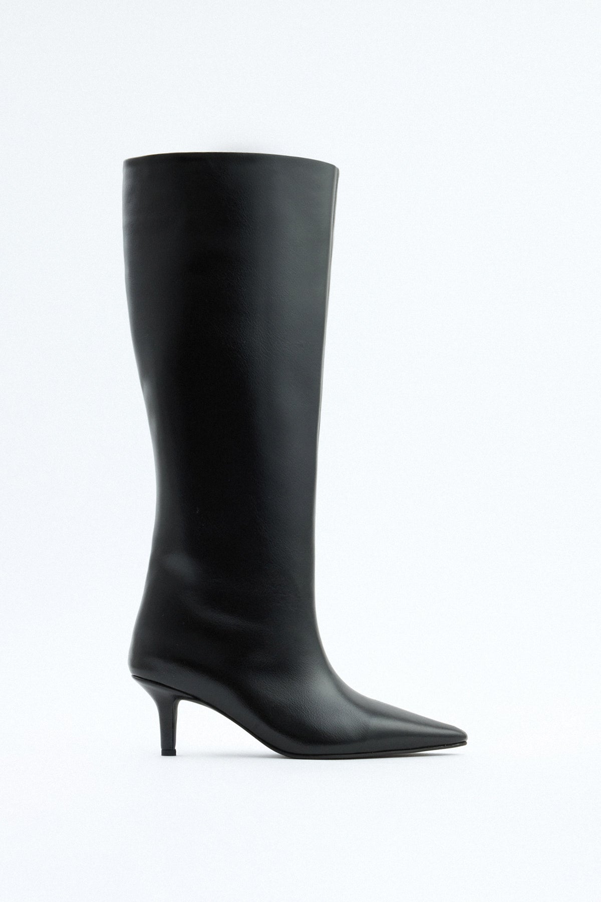 Mescini black pointed toe knee high boots, full side view on a studio backdrop, US sizes