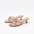 Mescini pink bow open toe kitten heel mules, pair angled on a white background, US women's sizes