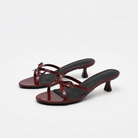 Mescini burgundy bow open toe kitten heel mules, pair angled on a white background, US women's sizes