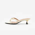 Mescini white bow open toe kitten heel mules, single shoe in full side view, US women's sizes