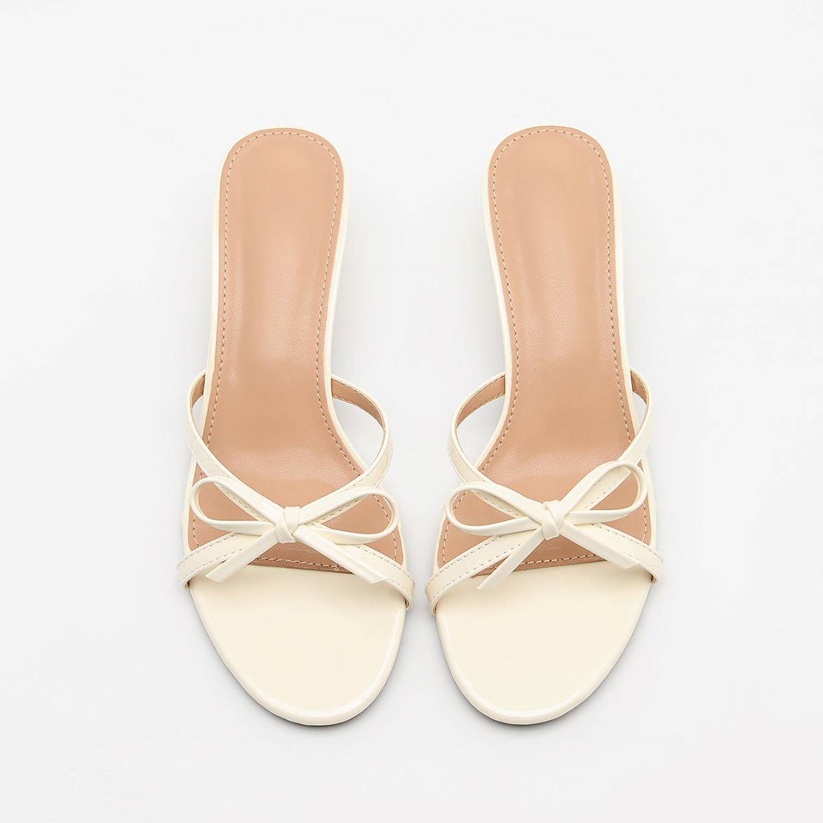 Mescini white bow open toe kitten heel mules, pair seen from directly above, US women's sizes