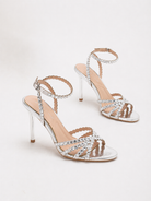 Mescini silver rhinestone strappy stiletto sandals, pair angled on a pale studio backdrop, US women's sizes