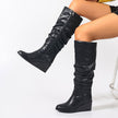 Mescini - black slouchy knee high wedge boots worn seated, full pair view, US women's sizes