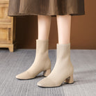 Mescini – apricot knit sock ankle boots worn under a brown midi skirt, US women's sizes