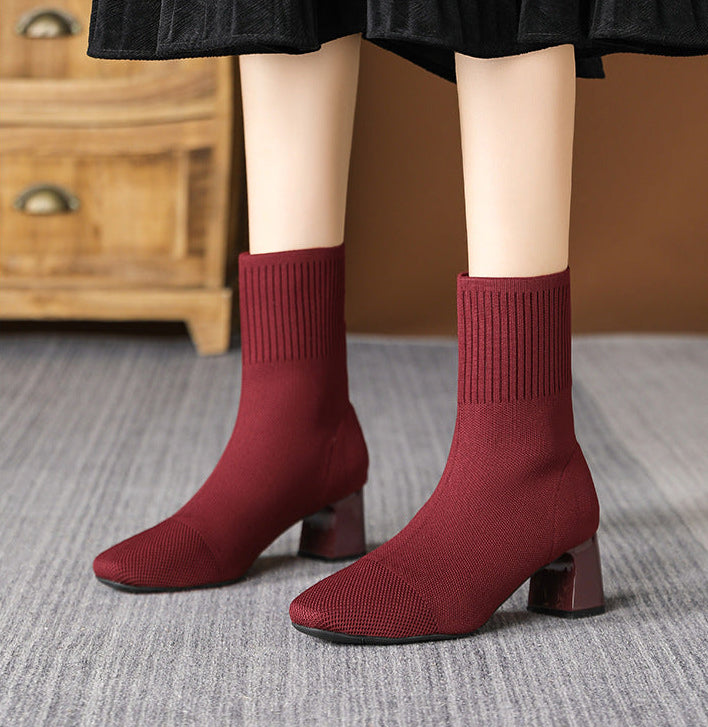 Mescini burgundy knit square toe sock ankle boots, worn standing on a grey rug, US women's sizes