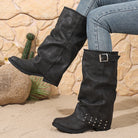 Mescini black fold over slouch boots worn with skinny jeans on sand, US women's sizes