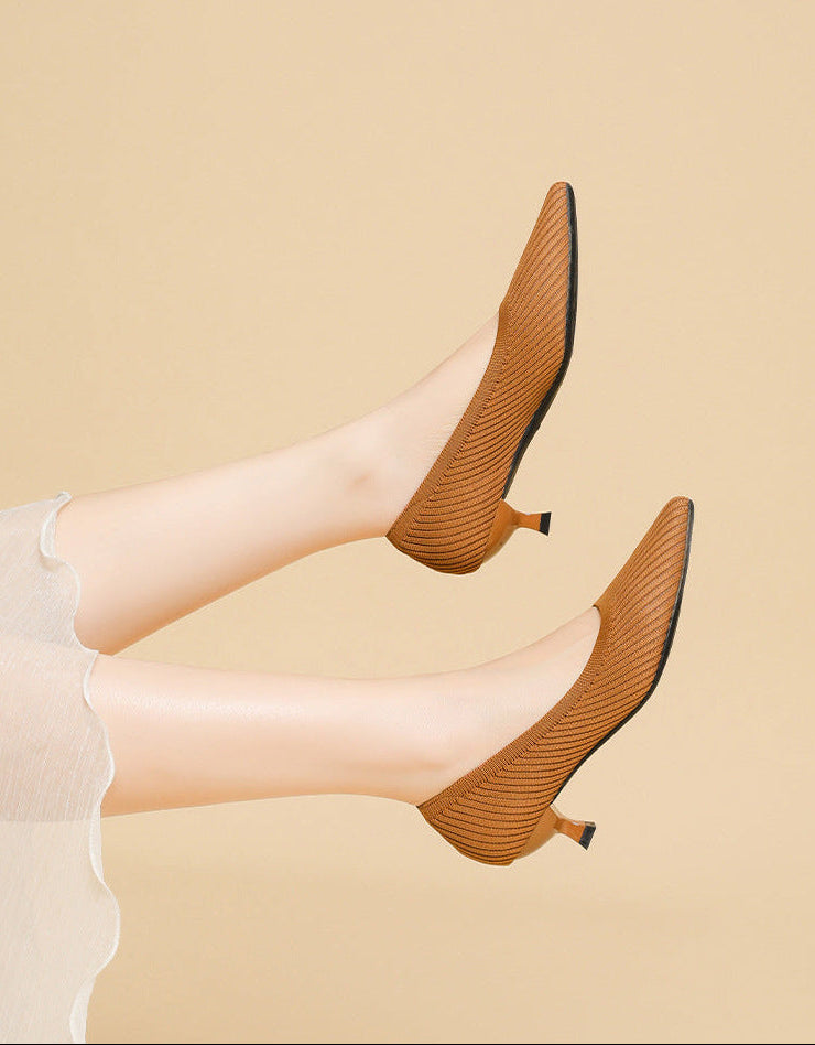 Mescini brown knit pointed toe kitten heel pumps, worn with both legs raised, US women's sizes