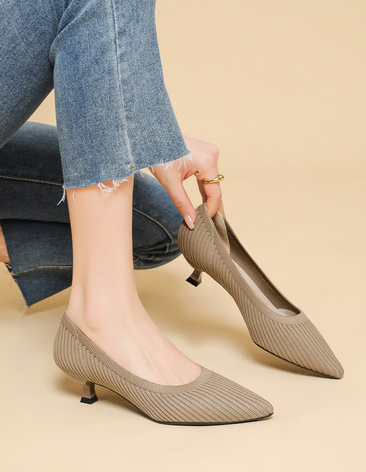 Mescini khaki knit pointed toe kitten heel pumps, worn with jeans, hand at one shoe, US women's sizes