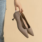 Mescini – taupe knit pointed toe kitten heel pumps held in one hand, US women's sizes