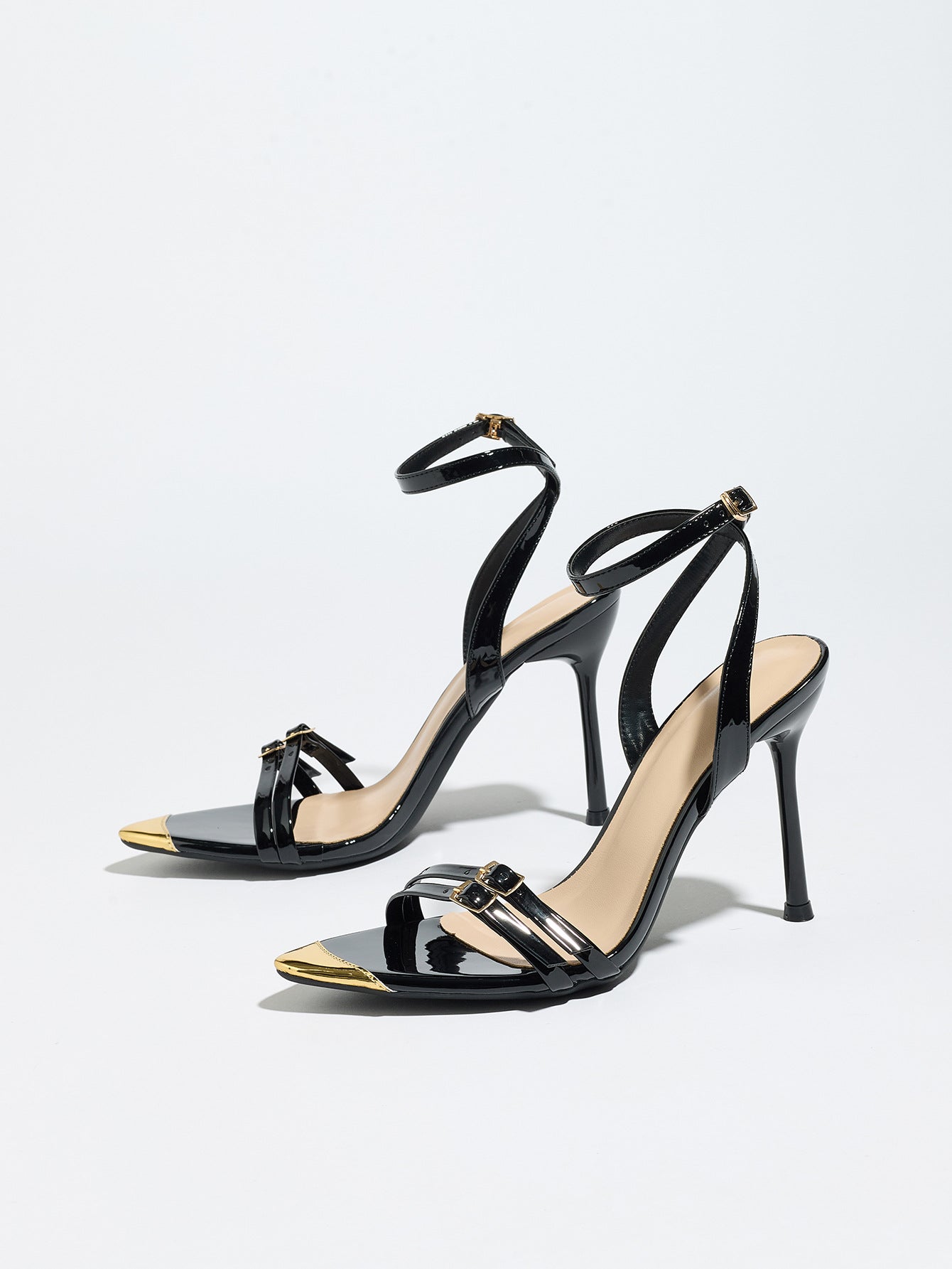 Mescini - Black gold tip ankle strap stiletto sandals, angled studio pair, US women's sizes
