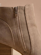 Close crop of the inside zip and back seam on Mescini taupe round toe ankle boots