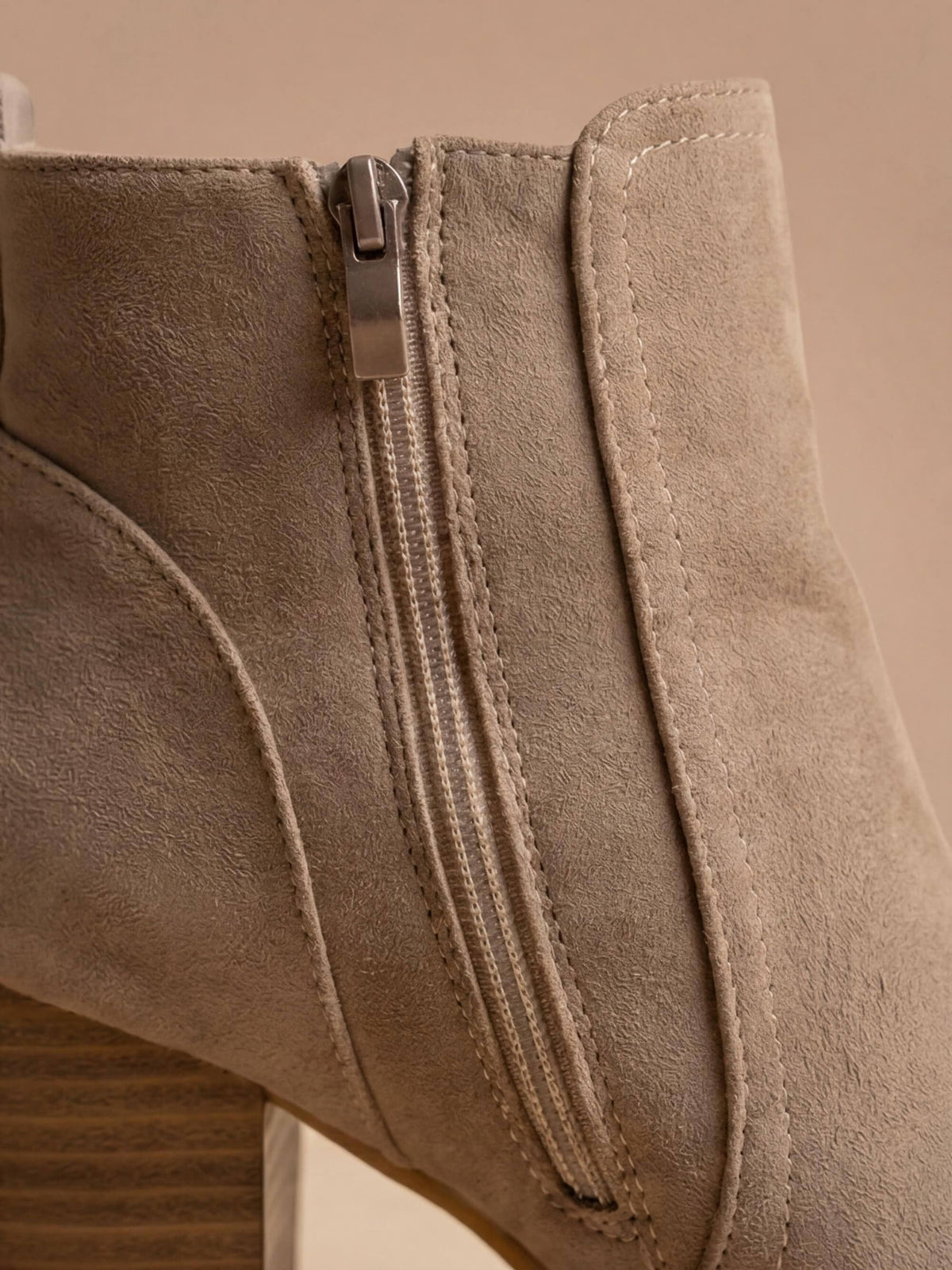 Close crop of the inside zip and back seam on Mescini taupe round toe ankle boots