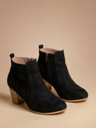 Mescini black round toe ankle boots with stacked block heel, angled pair view, US sizes