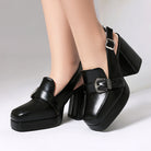 Mescini black square toe platform slingback loafers, worn close up, one foot forward, US women's sizes