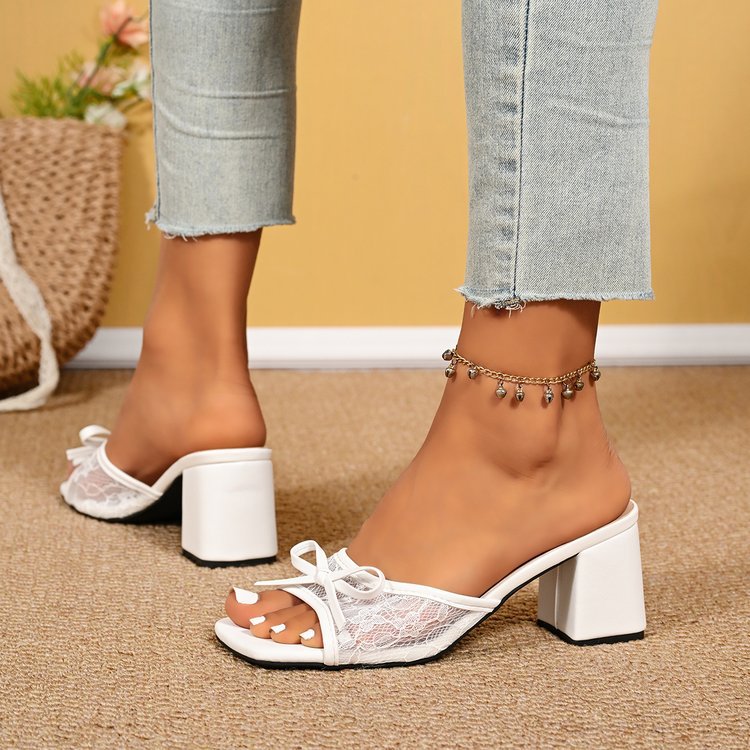 Mescini white square toe block heel mules, worn with jeans, seen from the side, US women's sizes