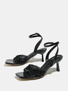 Mescini black rhinestone square toe heeled sandals, pair angled on a pale background, US women's sizes
