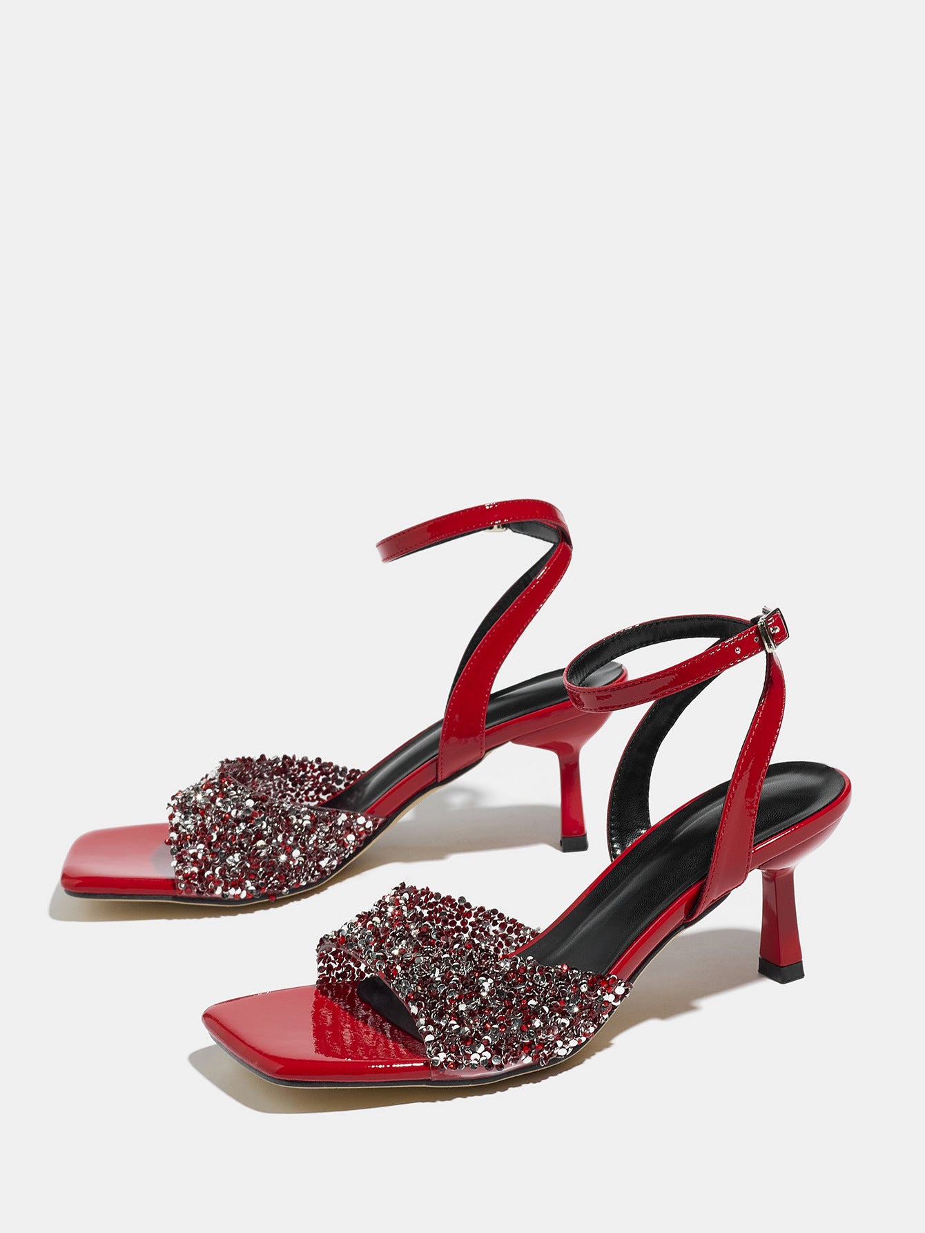 Mescini red rhinestone square toe heeled sandals, pair angled on a light backdrop, US women's sizes