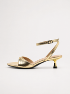 Mescini gold ankle strap kitten heel sandals, single shoe in full side view, US women's sizes