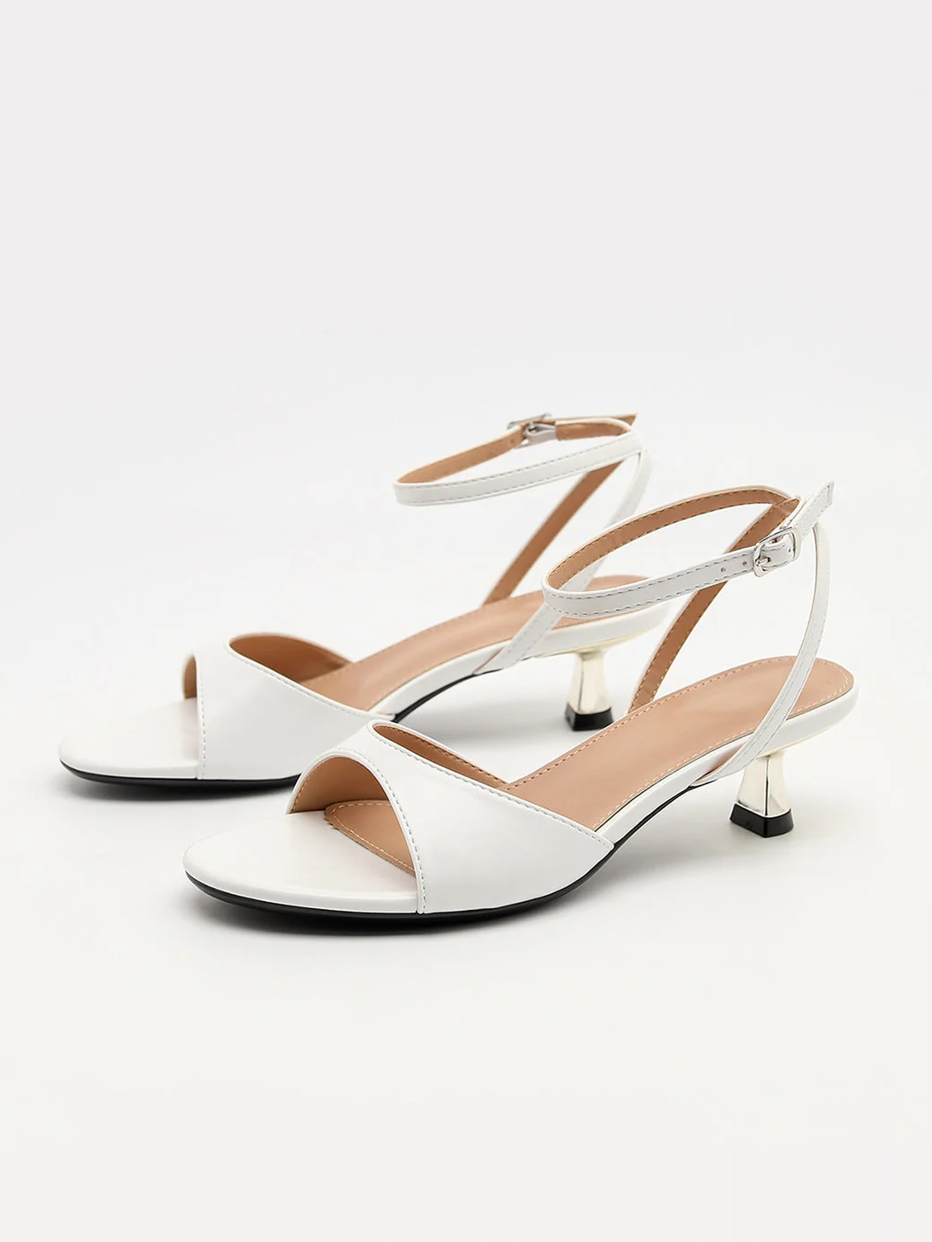Mescini white ankle strap kitten heel sandals, pair angled towards the camera, US women's sizes