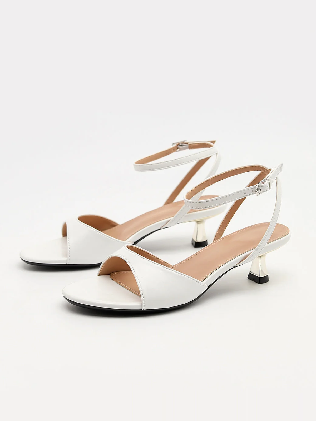 Mescini white ankle strap kitten heel sandals, pair angled towards the camera, US women's sizes