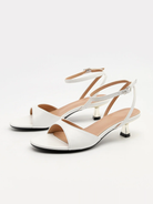 Mescini white ankle strap kitten heel sandals, pair angled towards the camera, US women's sizes